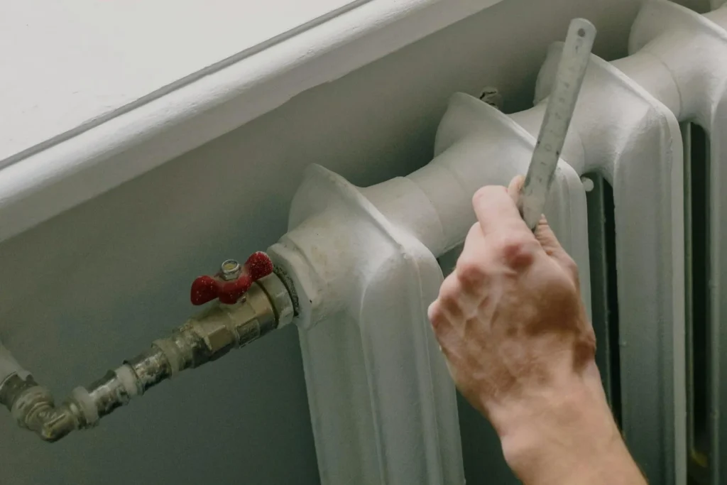Image of fixing a radiator / Снимка на поправка на радиатор, отопление и вентилация, ов